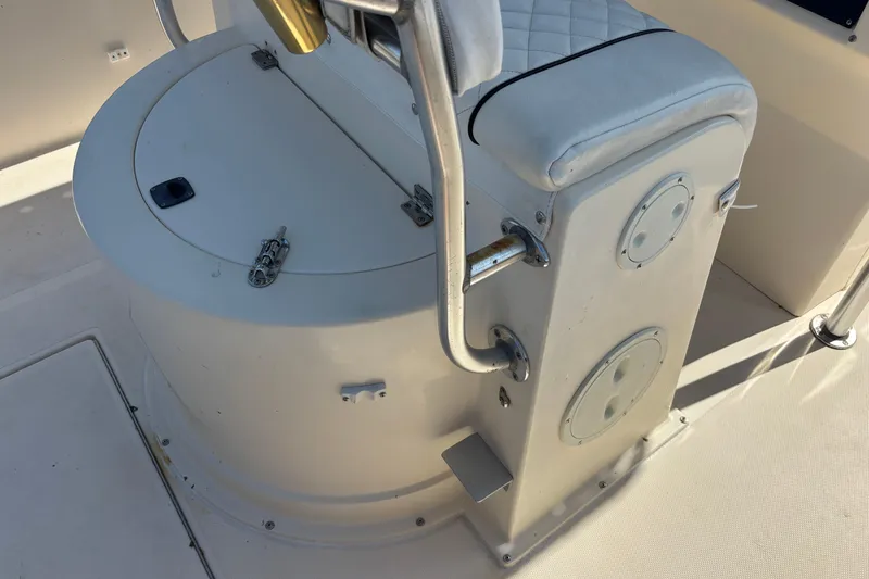 Slide: The Image of 2003 KenCraft 235 Challenger boat interior with seating and storage compartment. - 61