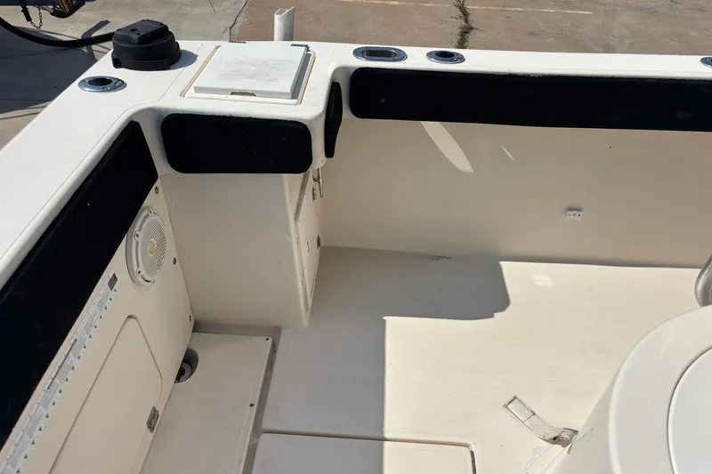 Slide: The Image of 2003 KenCraft 235 Challenger boat interior with storage and speaker. - 66