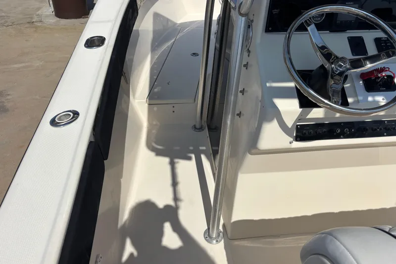 Slide: The Image of 2003 KenCraft 235 Challenger boat interior with steering wheel and control panel. - 67