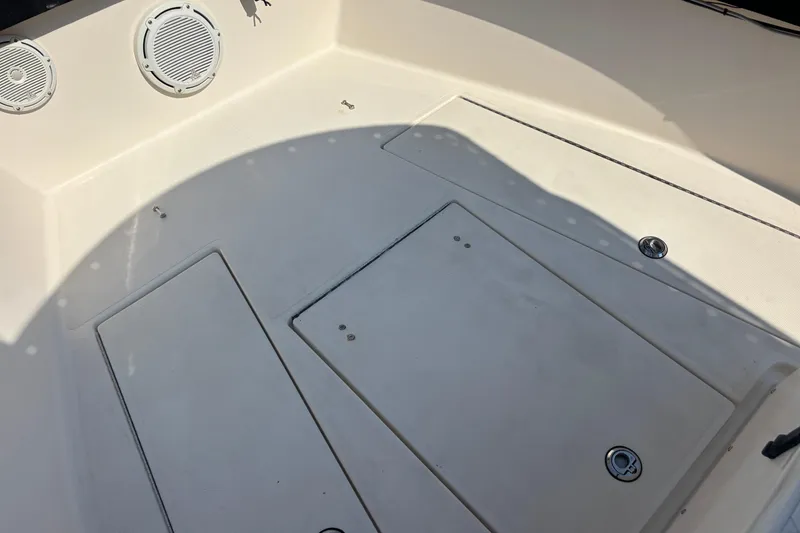 Slide: The Image of 2003 KenCraft 235 Challenger boat deck with storage compartments and speakers. - 69