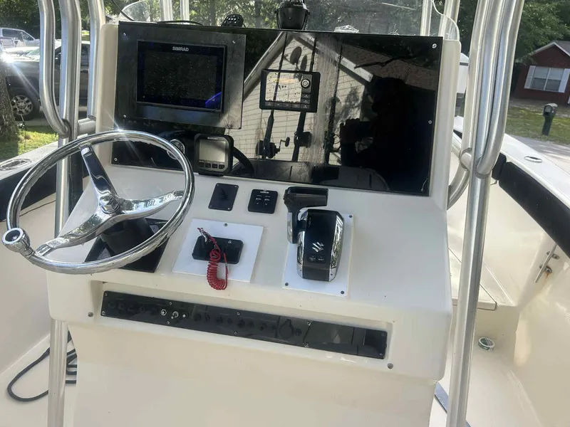 Slide: The Image of 2003 KenCraft 235 Challenger boat console with steering wheel and navigation equipment. - 7
