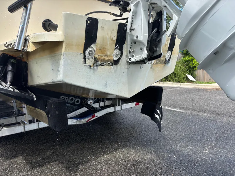 Slide: The Image of 2003 KenCraft 235 Challenger boat on trailer, showing stern and motor mount details. - 9