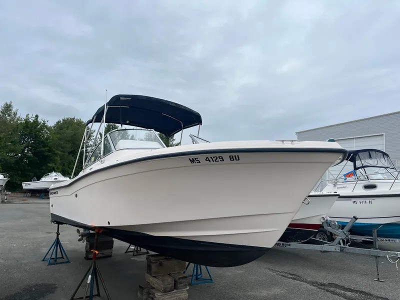 Slide: The Image of 2006 Grady-White Tournament 225 boat on stands, overcast sky background. - 2