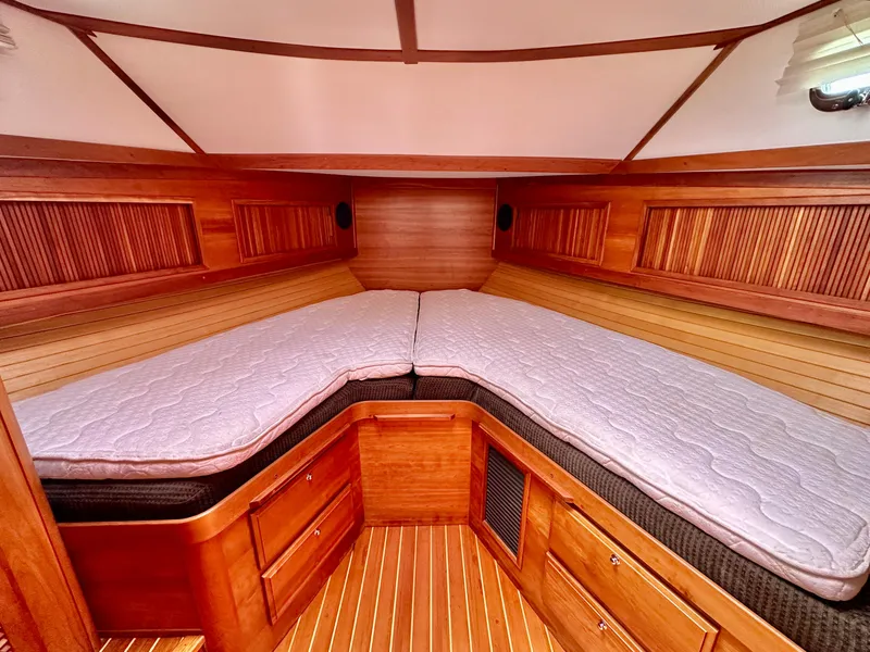 Slide: The Image of Cozy cabin interior of 2002 Sabreline 36 Flybridge with wooden finish and comfortable bedding. - 19