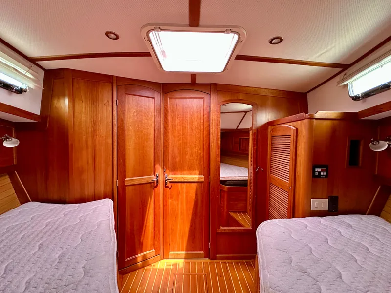 Slide: The Image of Luxurious 2002 Sabreline 36 Flybridge cabin with wooden interior and twin beds. - 23