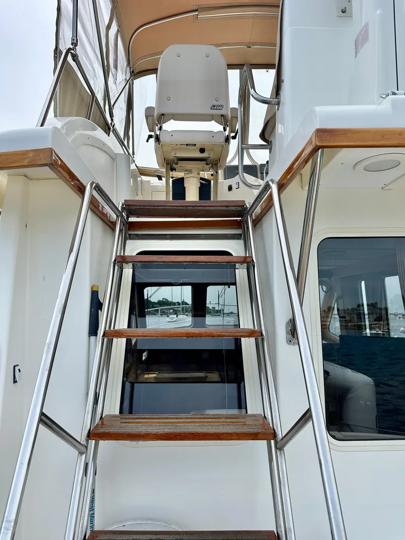Slide: The Image of Stairs leading to flybridge on 2002 Sabreline 36 Flybridge yacht. - 28