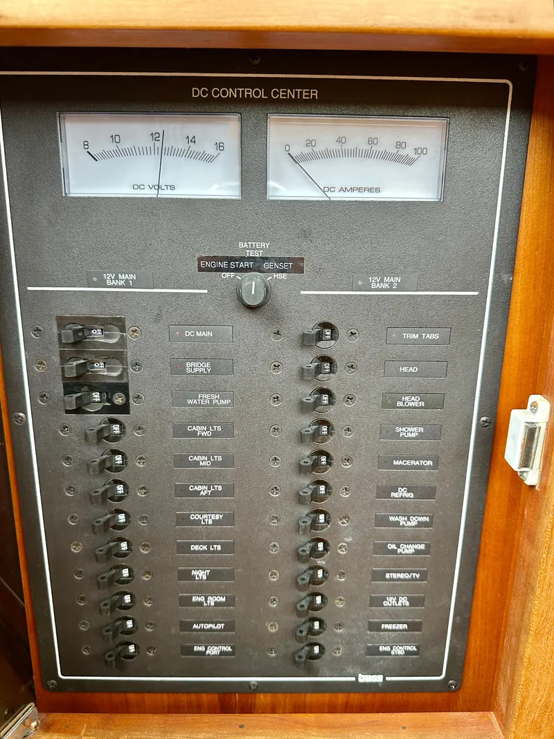 Slide: The Image of DC control panel of 2002 Sabreline 36 Flybridge with volt and amp meters. - 44