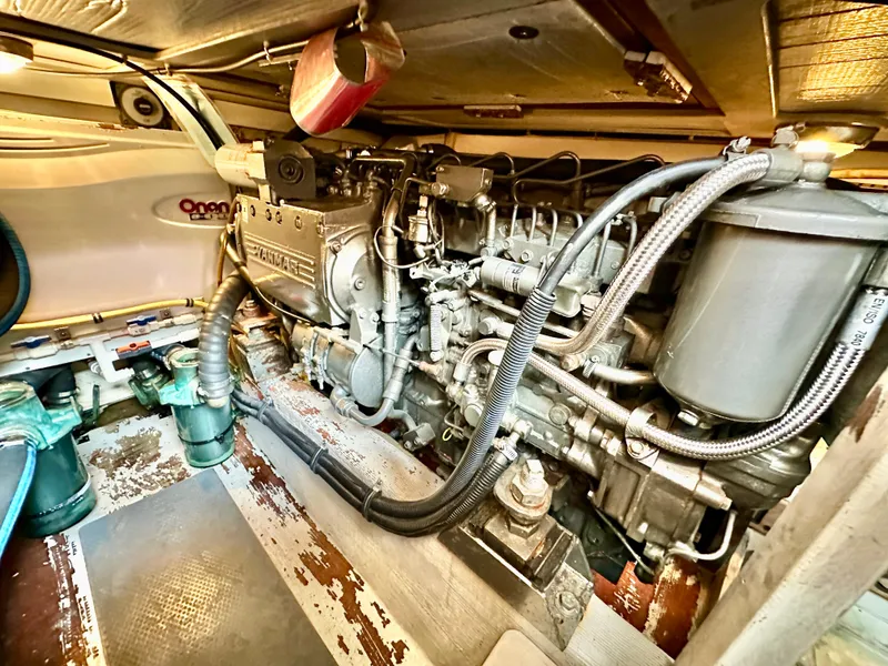 Slide: The Image of Engine room of 2002 Sabreline 36 Flybridge with Yanmar engine and Onan generator. - 48