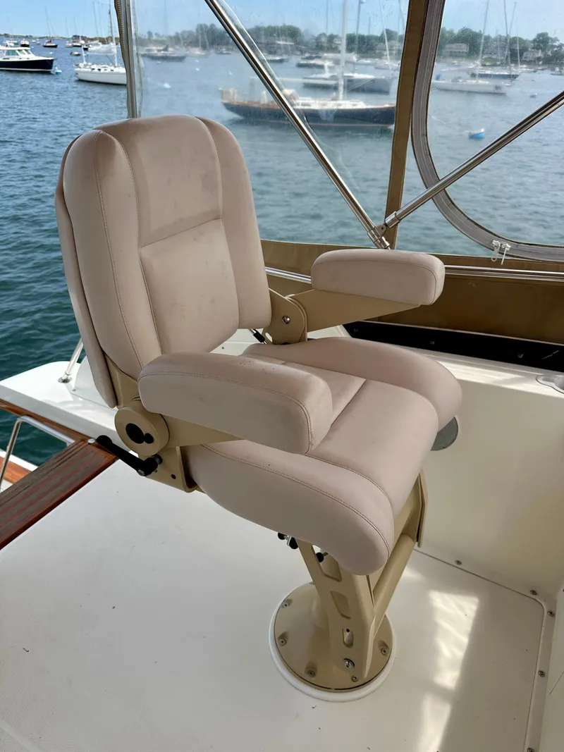 Slide: The Image of Captain's chair on 2002 Sabreline 36 Flybridge, overlooking marina. - 33
