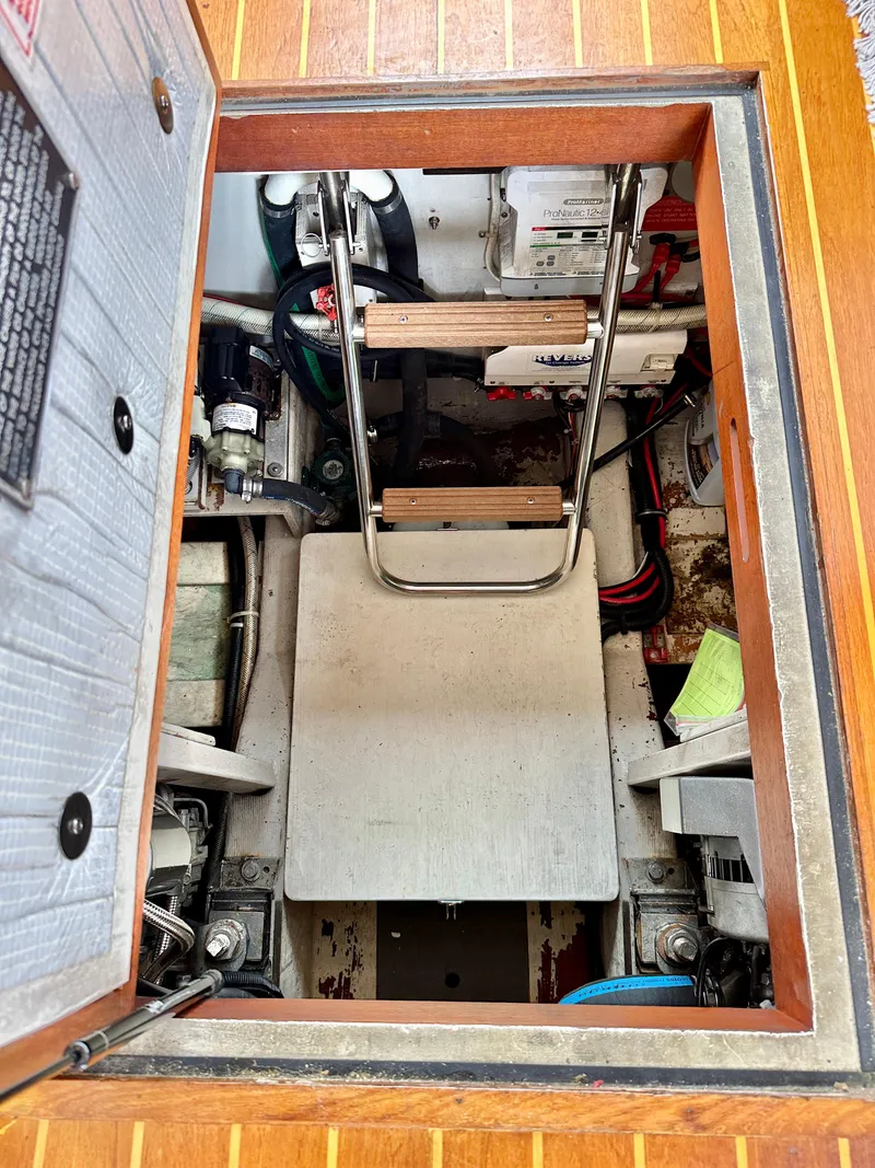 Slide: The Image of Engine compartment of a 2002 Sabreline 36 Flybridge with ladder and equipment. - 45