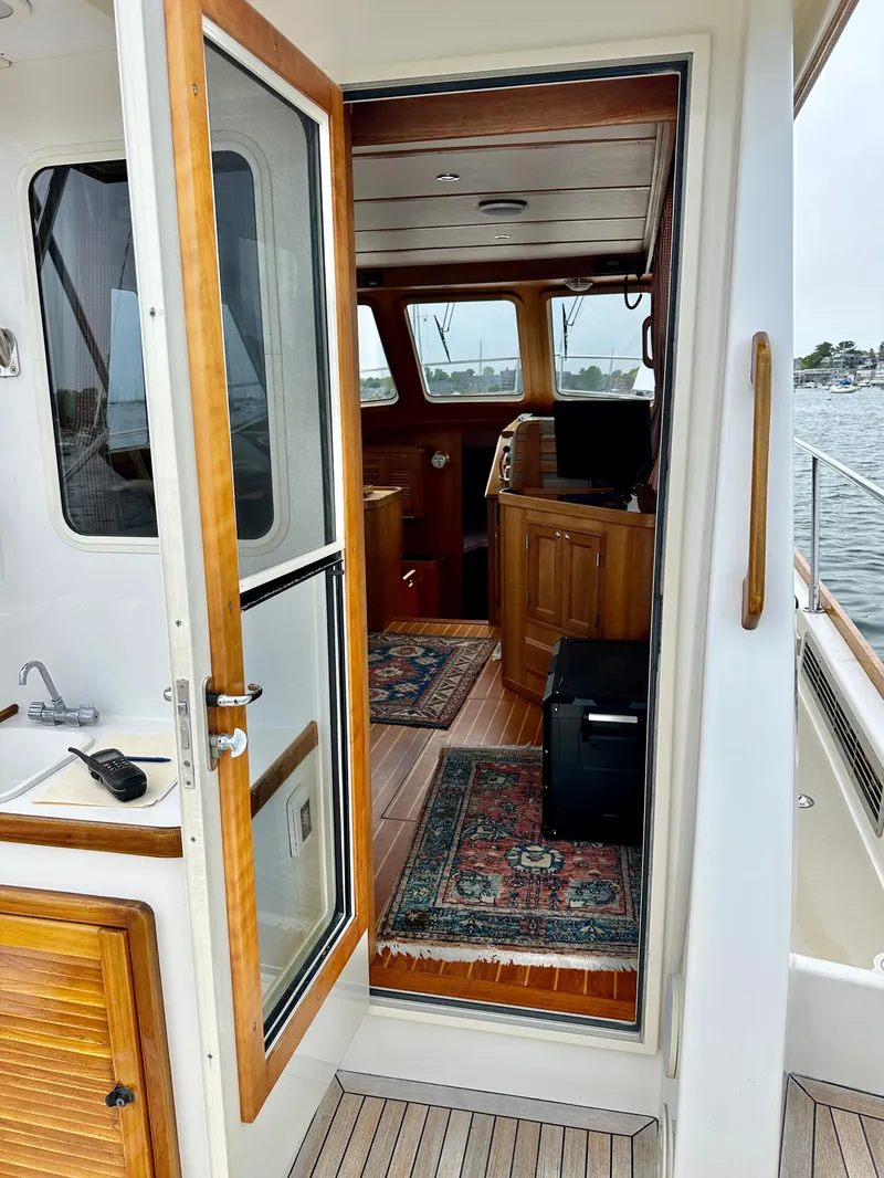 Slide: The Image of Interior view of 2002 Sabreline 36 Flybridge yacht with wooden accents and nautical decor. - 7