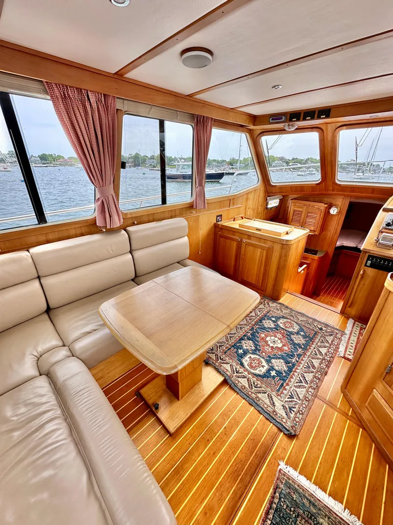 Slide: The Image of Interior of 2002 Sabreline 36 Flybridge yacht with wood finish and comfortable seating. - 9