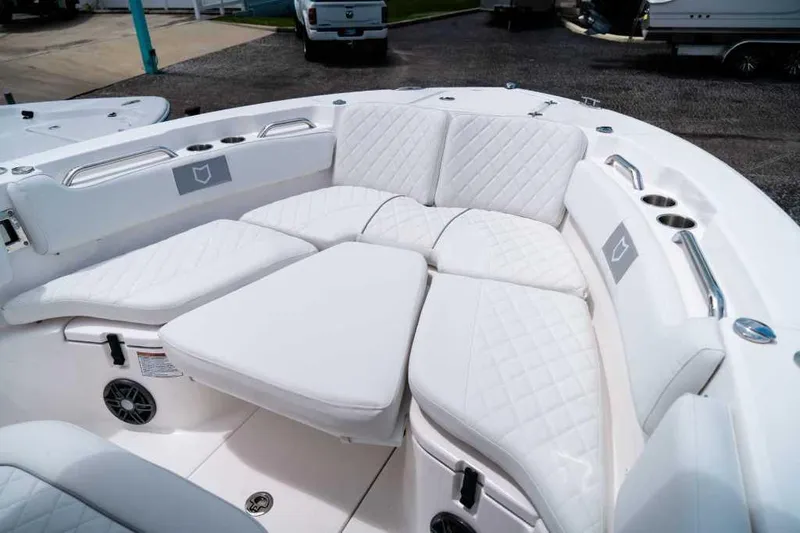 Slide: The Image of Luxurious seating on 2025 Sea Fox 228 Commander boat with white quilted upholstery. - 11