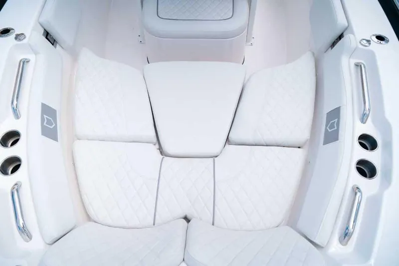 Slide: The Image of Luxurious seating on 2025 Sea Fox 228 Commander boat, featuring white quilted cushions. - 14