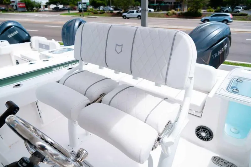 Slide: The Image of 2025 Sea Fox 228 Commander boat interior with white seating and Yamaha engines. - 18