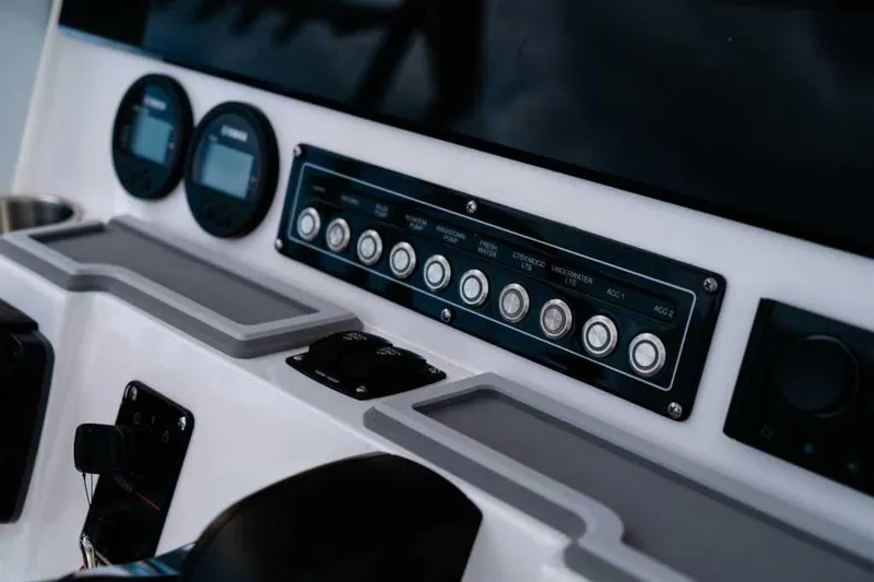 Slide: The Image of 2025 Sea Fox 228 Commander dashboard with gauges and control panel. - 21