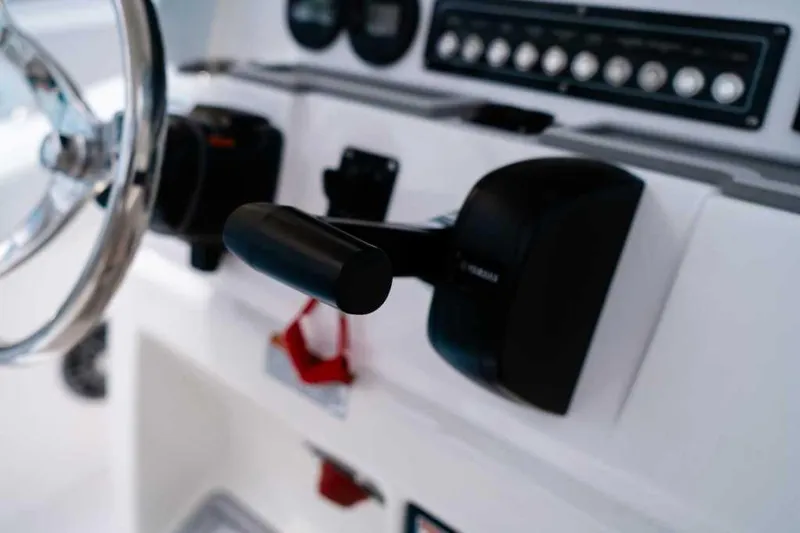 Slide: The Image of Close-up of 2025 Sea Fox 228 Commander boat controls and steering wheel. - 22