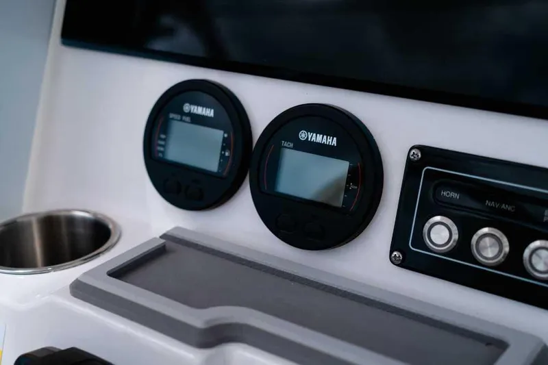 Slide: The Image of 2025 Sea Fox 228 Commander dashboard with Yamaha gauges and control panel. - 23