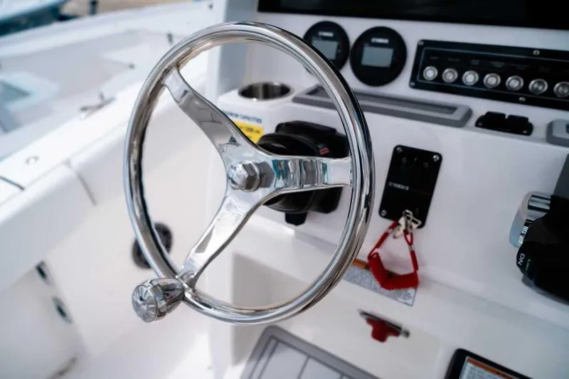 Slide: The Image of Steering wheel of 2025 Sea Fox 228 Commander boat, featuring modern dashboard controls. - 24
