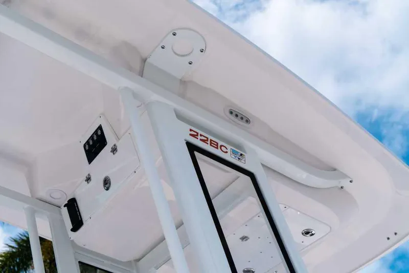 Slide: The Image of 2025 Sea Fox 228 Commander boat roof detail against blue sky. - 4