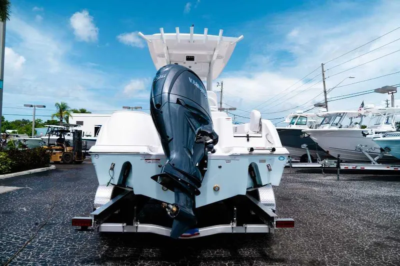 Slide: The Image of 2025 Sea Fox 228 Commander boat with outboard motor in a marina. - 5