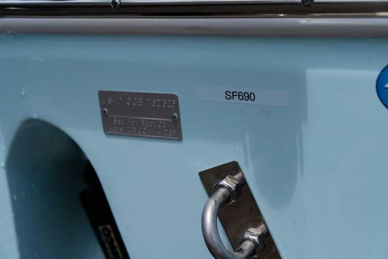 Slide: The Image of 2025 Sea Fox 228 Commander boat detail with SF690 label and metal handle. - 6