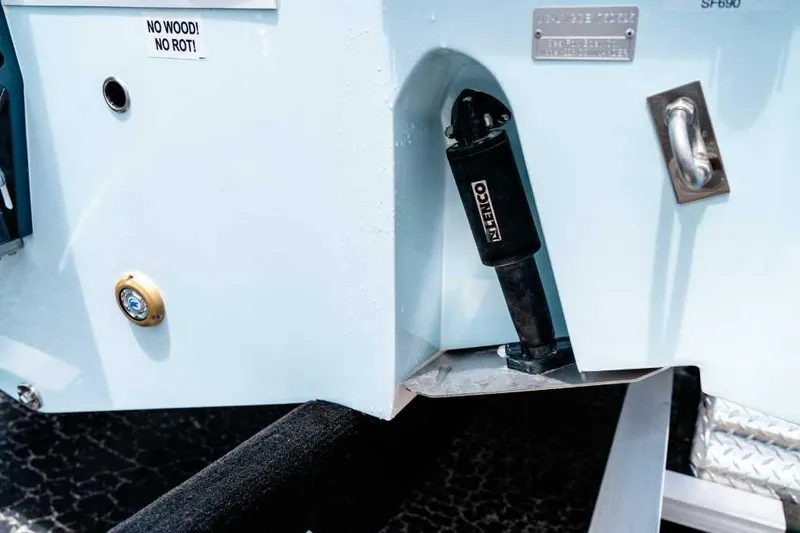 Slide: The Image of 2025 Sea Fox 228 Commander boat detail showing hydraulic component and "No Wood! No Rot!" label. - 7