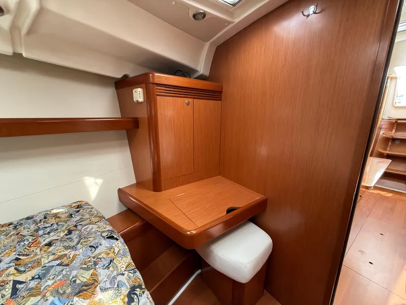 Slide: The Image of Interior of 2008 Beneteau Oceanis 40 yacht with wooden cabinetry and seating. - 12