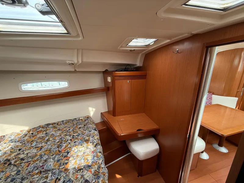 Slide: The Image of Interior of 2008 Beneteau Oceanis 40 yacht with cozy cabin and wooden furnishings. - 13