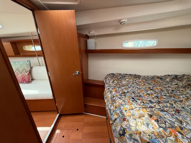 Slide: The Image of Interior of 2008 Beneteau Oceanis 40 sailboat, featuring cozy cabin and wooden finishes. - 15