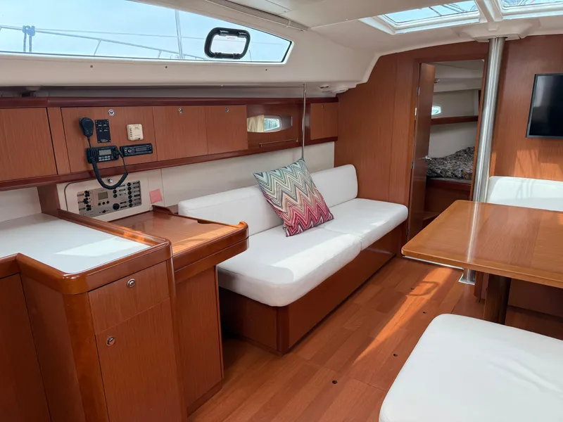 Slide: The Image of Interior of 2008 Beneteau Oceanis 40 yacht with wood finish and white seating. - 23