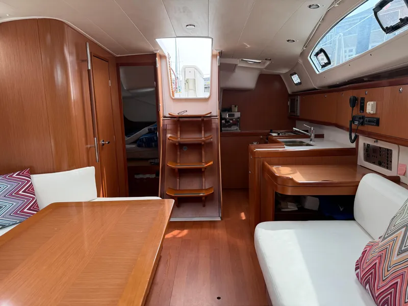 Slide: The Image of Interior of 2008 Beneteau Oceanis 40 sailboat with wood finish and modern amenities. - 26