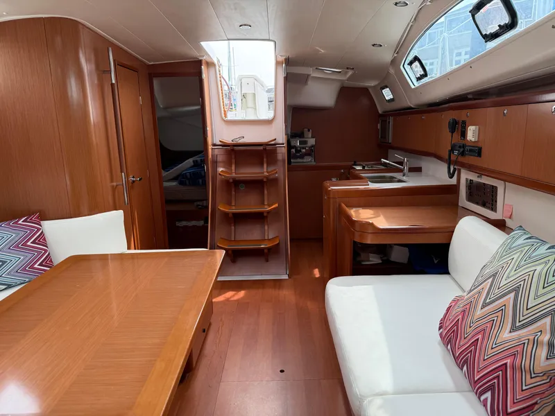 Slide: The Image of Interior of 2008 Beneteau Oceanis 40 sailboat with wood finish and modern amenities. - 27