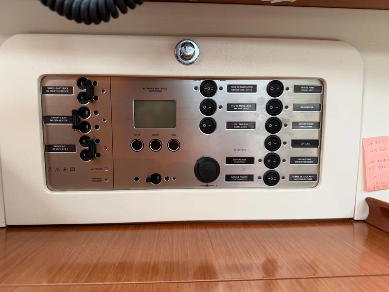 Slide: The Image of Control panel of a 2008 Beneteau Oceanis 40 yacht, featuring various switches and indicators. - 29