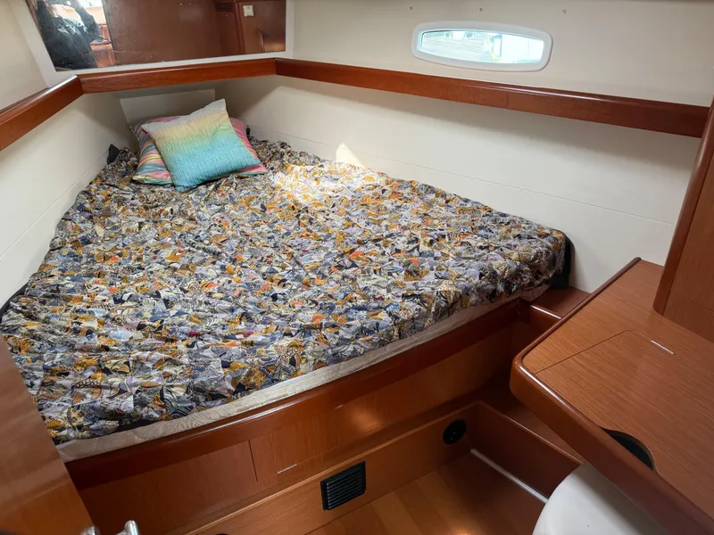 Slide: The Image of Cozy cabin interior of 2008 Beneteau Oceanis 40 sailboat with colorful bedding. - 8
