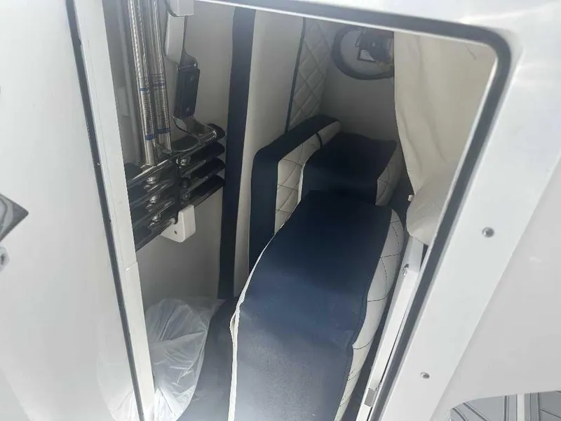 Slide: The Image of Interior cabin of 2026 Sea Fox 288 Traveler boat with seating and storage. - 10