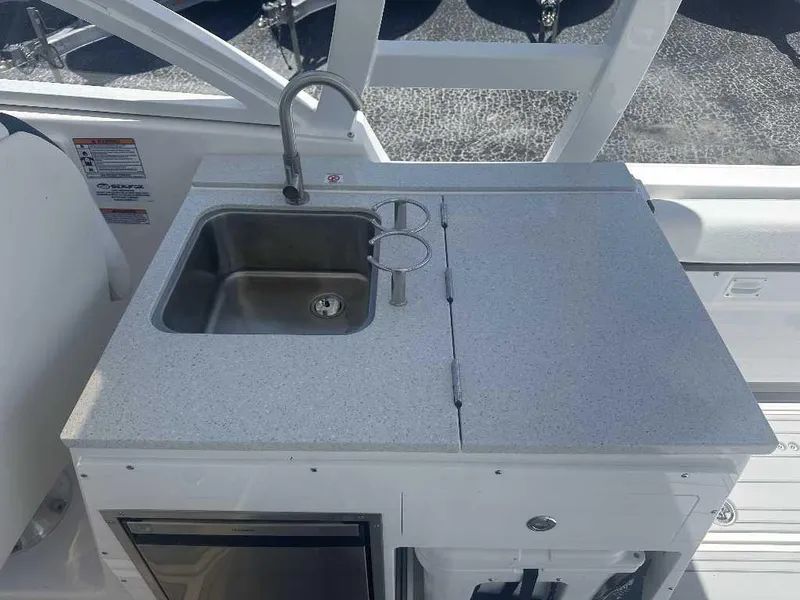 Slide: The Image of 2026 Sea Fox 288 Traveler boat kitchenette with sink and countertop. - 12