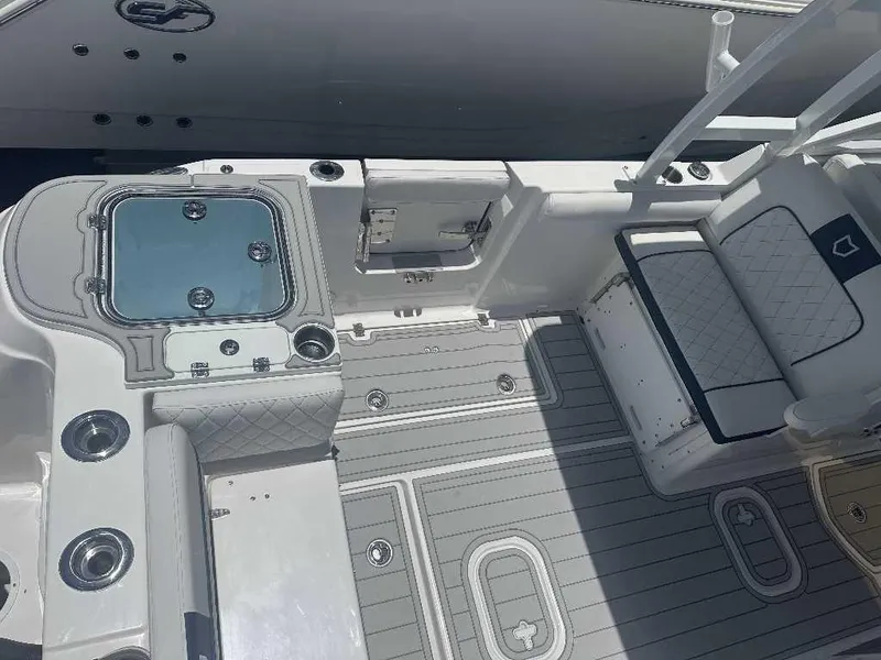 Slide: The Image of 2026 Sea Fox 288 Traveler boat interior with seating and storage compartments. - 13