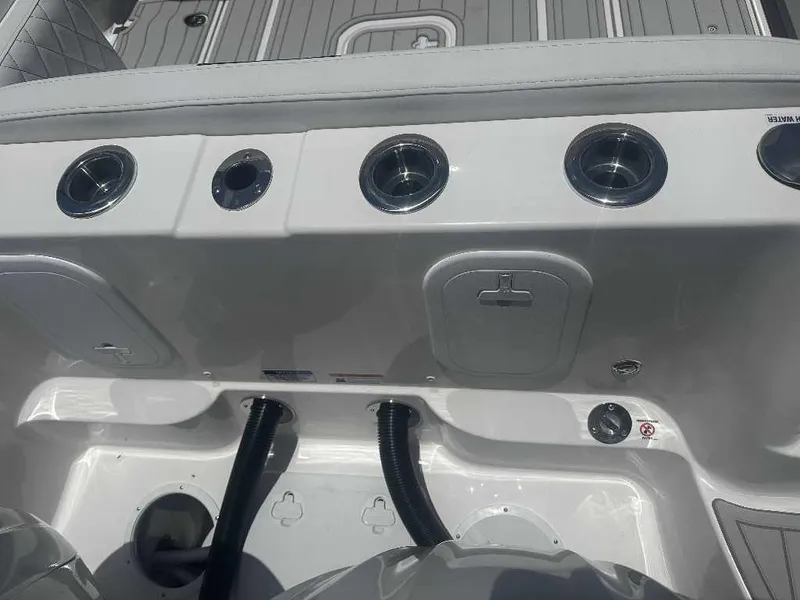 Slide: The Image of 2026 Sea Fox 288 Traveler boat interior with cup holders and storage compartments. - 2
