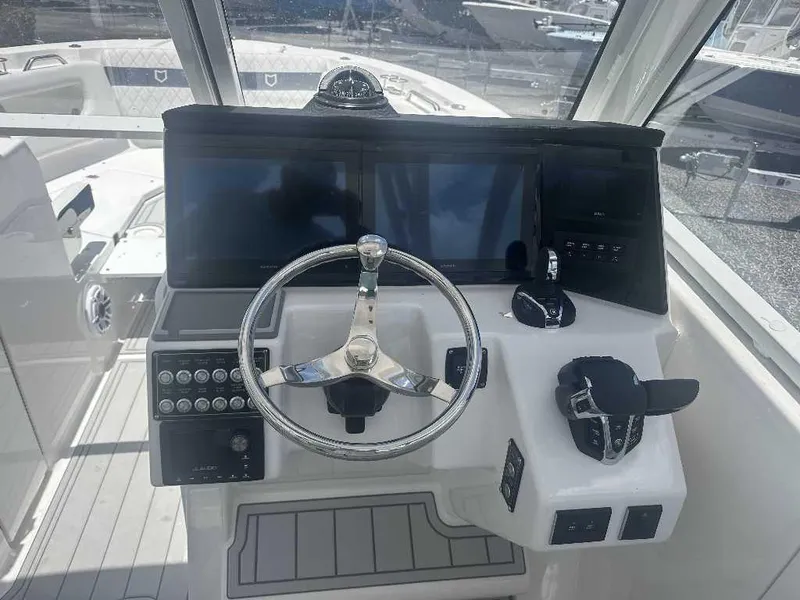 Slide: The Image of Helm of 2026 Sea Fox 288 Traveler with modern controls and dual screens. - 6