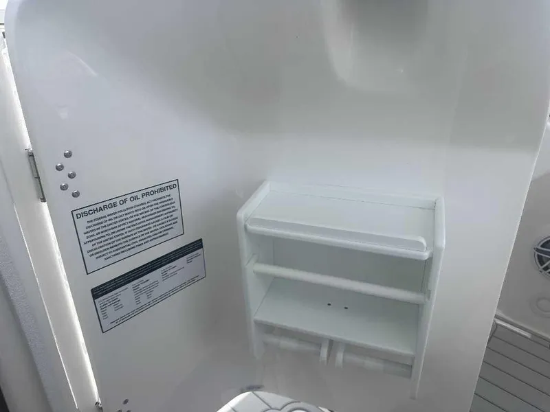 Slide: The Image of Interior of 2026 Sea Fox 288 Traveler boat with storage shelves and safety notice. - 8