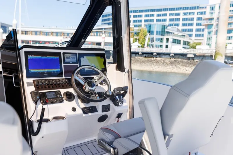 Slide: The Image of Interior of 2026 Solara S-310 CW boat with advanced navigation controls and modern design. - 5