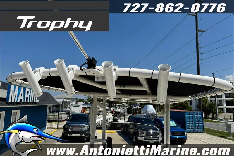 Slide: The Image of 2025 Trophy T20 CC boat with rod holders at Antonietti Marine dealership. - 20