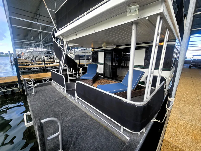 Slide: The Image of 1996 Sumerset 82'x 18' Widebody Houseboat with outdoor seating and spiral staircase. - 13