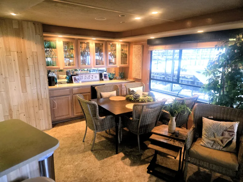 Slide: The Image of Luxurious interior of a 1996 Sumerset 82'x 18' Widebody Houseboat with elegant dining area. - 15