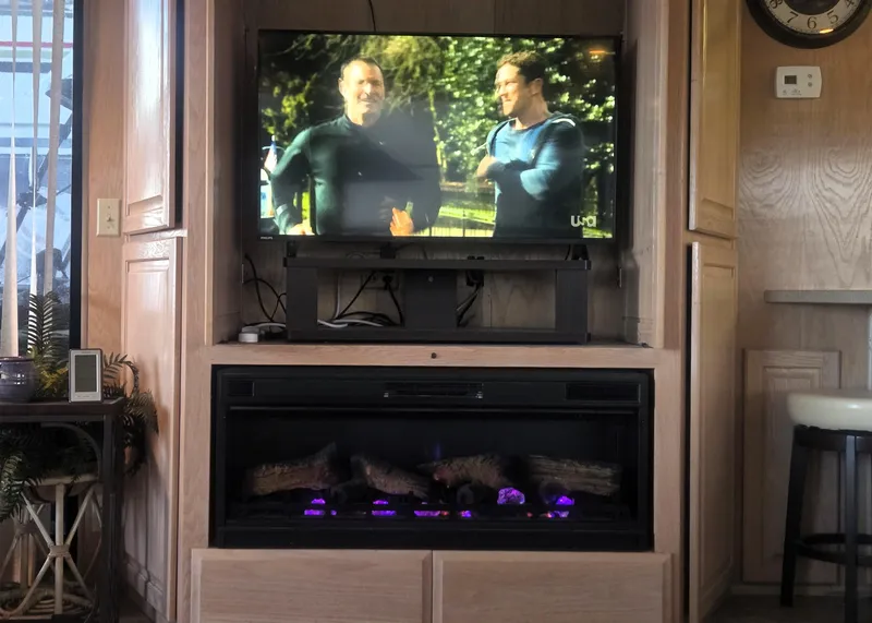 Slide: The Image of Interior of 1996 Sumerset houseboat with TV and electric fireplace. - 16