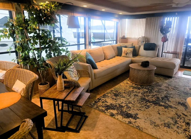 Slide: The Image of Luxurious interior of a 1996 Sumerset 82'x 18' Widebody Houseboat with cozy seating and decor. - 20