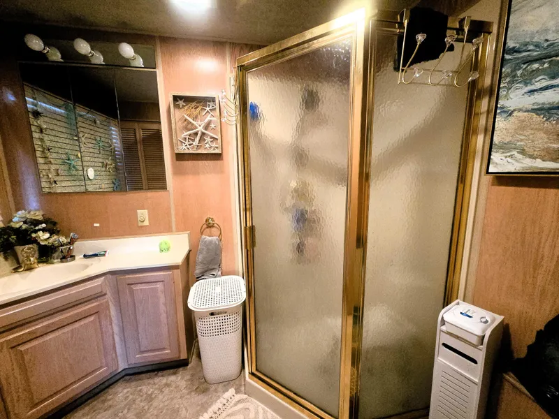 Slide: The Image of Bathroom interior of a 1996 Sumerset 82'x 18' Widebody Houseboat with shower and vanity. - 33