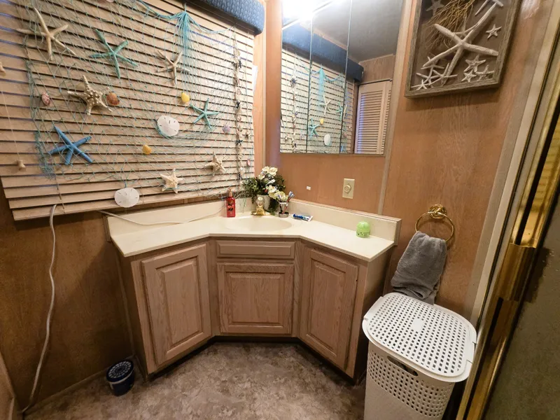 Slide: The Image of Bathroom interior of 1996 Sumerset 82'x 18' Widebody Houseboat with nautical decor. - 34