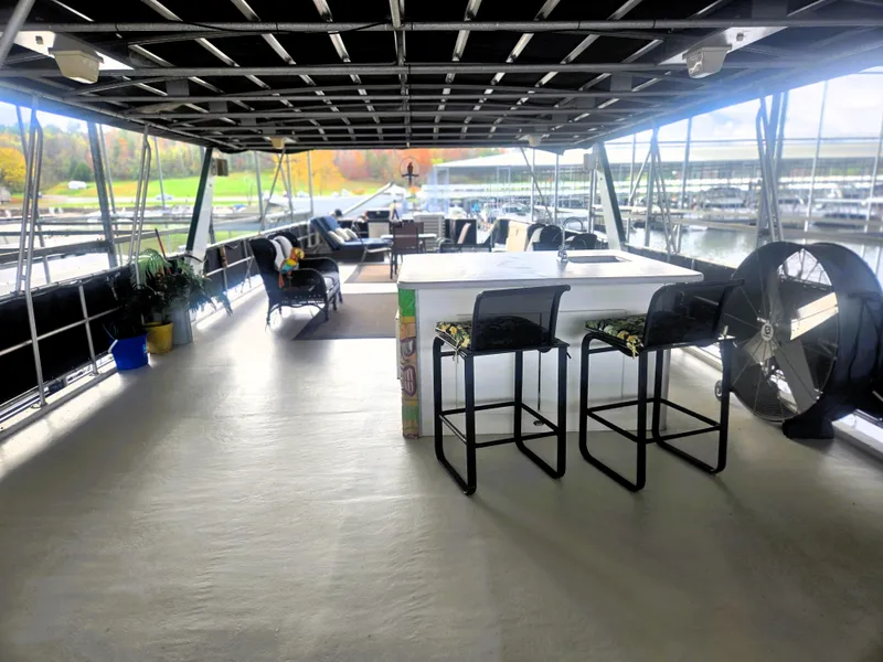 Slide: The Image of Spacious deck of 1996 Sumerset 82'x 18' Widebody Houseboat with seating and bar area. - 5
